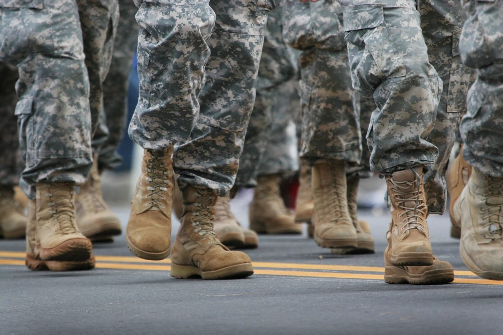 fm=f_69372 A close up of soldiers in fatigues and boots